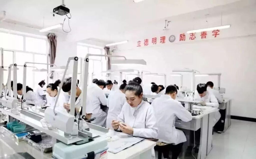 dental lab technician works on the prosthesis